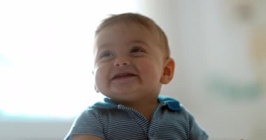 Cute baby infant toddler boy opening mouth smiling feeling joy