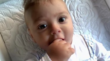 Baby infant face closeup expression feeling happy