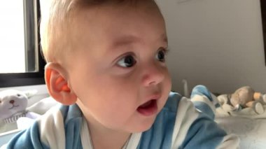 Closeup of baby interacting exploring the world