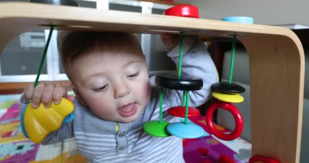 Baby Toddler Putting Toy Mouth Discovering World — Stockvideo