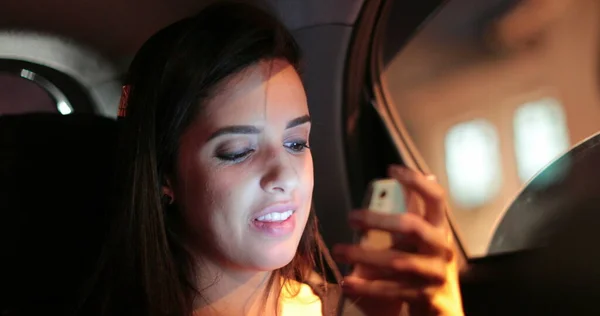 Passenger Young Woman Checking Holding Her Cellphone While Riding Taxi —  Fotos de Stock