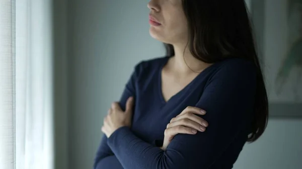 Worried Woman Standing Window Touching Her Neck Chest Seeking Comfort — Stock Photo, Image