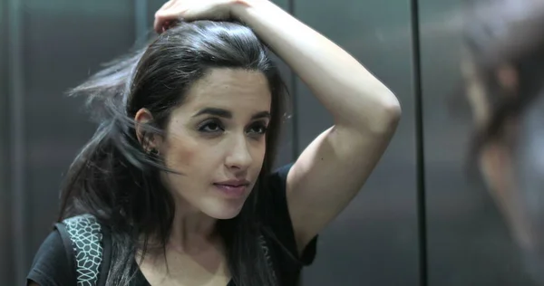 Young Hispanic Latina Woman Checking Herself Elevator Mirror Arranging Hair — Foto Stock