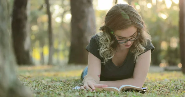 Smart Intelligent Girl Wearing Glasses Lying Grass Park Reading Book — Stockfoto