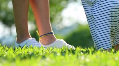 Child first baby steps outside in nature