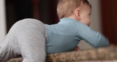 Toddler baby learning to climb step stair