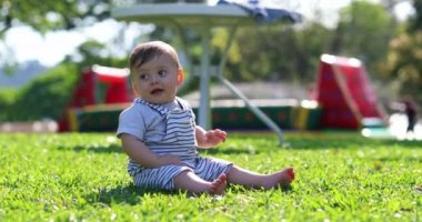 Cute baby child outside in nature smiling