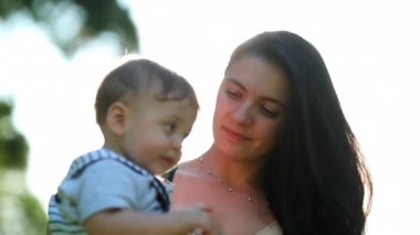 Mother and baby child together in outdoors
