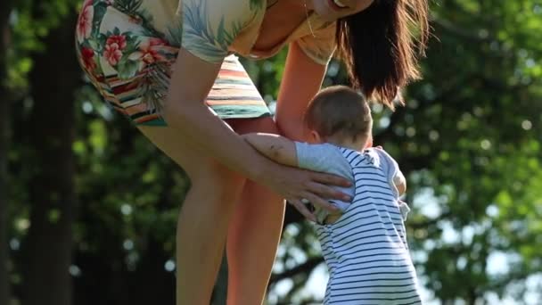 Mother Lifting Baby Son Air Park Nature — Vídeo de stock