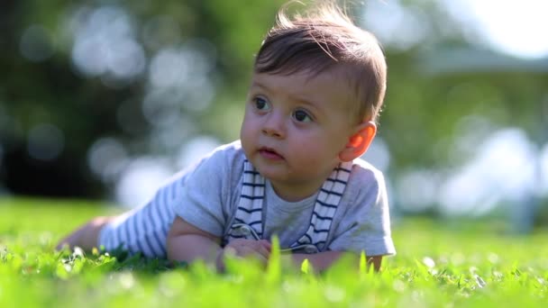 Contemplative Baby Child Lost Thought Thinking Lying Grass Outdoor — Vídeo de Stock