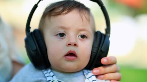 Baby Infant Wearing Headphone Listening Music — Stockvideo