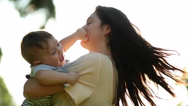 Authentic Mother Holding Happy Baby Infant Son Outdoor Nature Lens — Vídeo de Stock