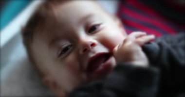 Happy joyful adorable cute baby toddler infant smiling and laughing looking to camera