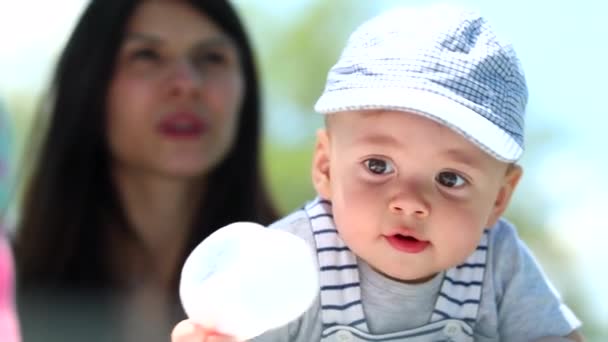 Cute Baby Portrait Wearing Hat Looking Outdoors Sunlight — Stock video