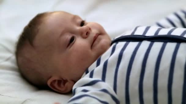 Adorable Toddler Baby Laid Bed Looking Camera — Vídeos de Stock
