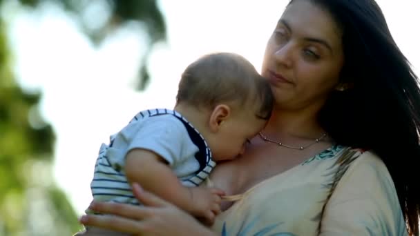 Mother Holding Baby Son Outdoors Portrait Lens Flare Sunshine — Stok video