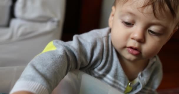 Baby Toddler Choosing Toy Box Infant Boy Grabbing Car Toy — Stockvideo