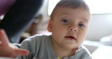 Adorable baby toddler boy face portrait smiling, authentic and real life cute baby smile