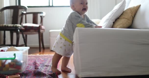 Child Baby Toddler Holding Couch Learning Walk — Stock Video