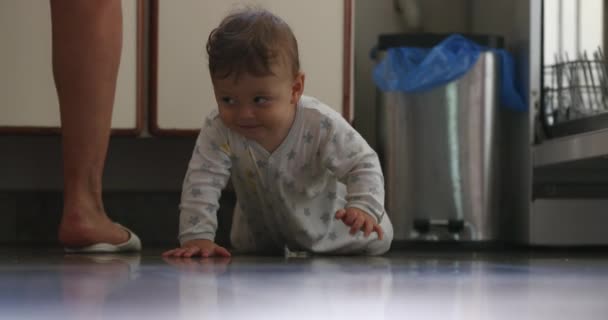 Happy Baby Toddler Crawls Kitchen Floor Smiling — Stock video