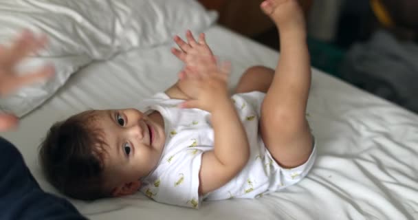 Adorable Baby Clapping Hands Smiling Looking Camera While Laid Bed — Wideo stockowe