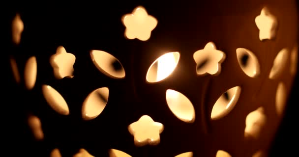 Orange Warm Candle Burning Seen Surface Holes — ストック動画