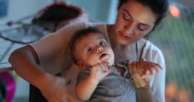Difficult annoyed baby infant complaining hitting parent. Irritated toddler boy, frustrated caring mother