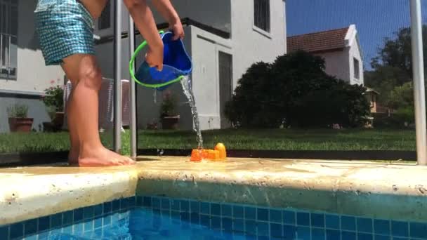 Toddler Baby Boy Playing Bucket Swimming Pool Setting — Stockvideo