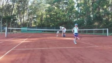 Punta del Este, Uruguay, December 27 2018 - Child holding tennis racket about play game