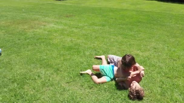 Children Real Life Fighting Wrestling Outdoors — Stockvideo