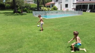 Little brothers fighting over soccer game, real life wrestle between siblings