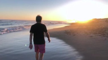 Retired Senior man walking at the beach