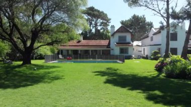 Beautiful home exterior. Establishing shot of house in sunny day