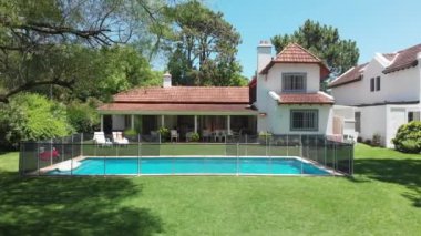 Establishing exterior shot of home during beautiful bright sunny day