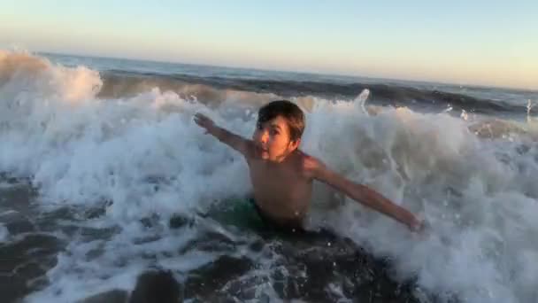 Child Boy Playing Beach Waves Crashing Victory Dance — Video Stock