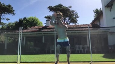 Child jumping inside water going underwater in super slow-motion 240fps