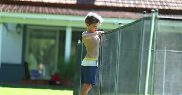 Child Trying Remove Swimming Pool Safety Fence — Wideo stockowe