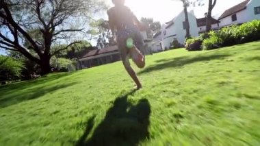 Young boy running outside and jumping inside pool water