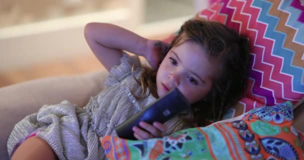 Little Girl Child Holding Remote Control Watching Screen Home Couch — Stock Video