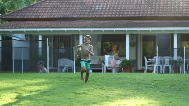 Kid Runs Outdoors Home Garden — Video Stock