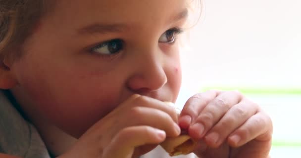 Closeup Baby Boy Face Eating Chewing Food — Vídeos de Stock