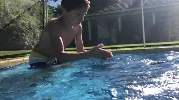 Kid Diving Blue Clear Swimming Pool Water — Stockvideo