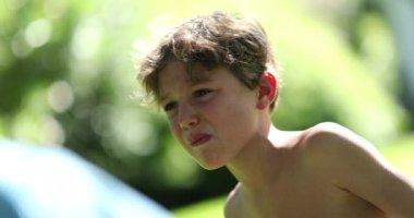 Tearful crying angry child boy