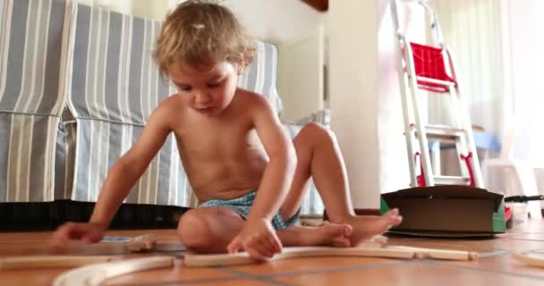 Kid Playing Toys Indoors Infant Toddler Playing Home Alone — Vídeo de Stock