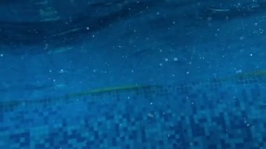 child jumps inside water in super slow-motion