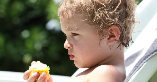 Kid Thinking Deep Thought Holding Corn — Video Stock