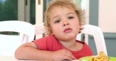 Child boy portrait talking by himself