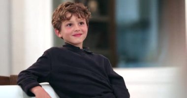 Handsome child spontaneous smile, happy real life authentic candid kid