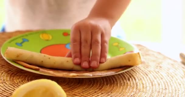 Child Hands Rolling Pancake — Stockvideo