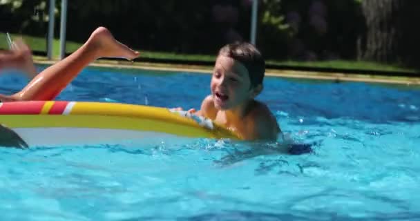 Young Boy Swimming Pool Water Having Fun Smiling — стоковое видео